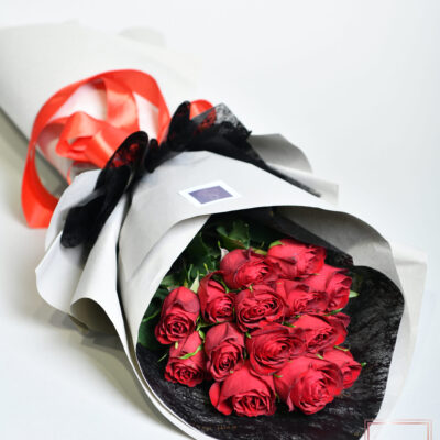 A bouquet of 15 red roses in an elegant package