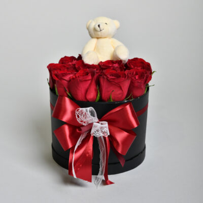 Honey on a surface of red roses